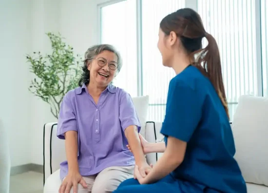 female-doctor-taking-care-and-talking-mature-female-patient-1